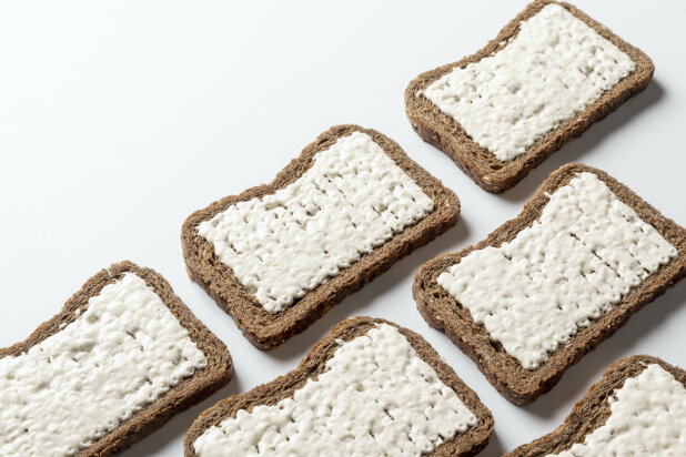 Various slices of bread surface covered with butter by a FoodJet cream depositor
