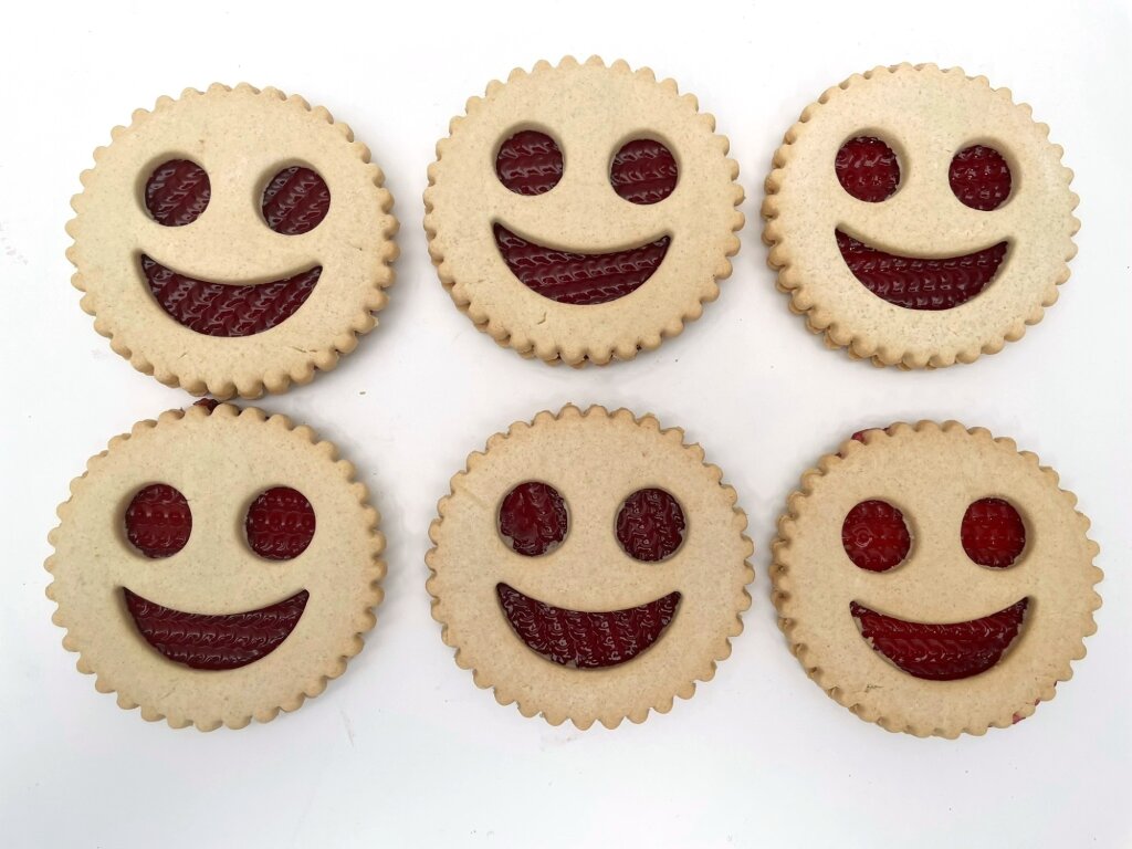 Biscuits with a jam smiley face